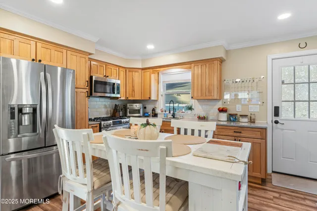 a kitchen with a sink stove and refrigerator