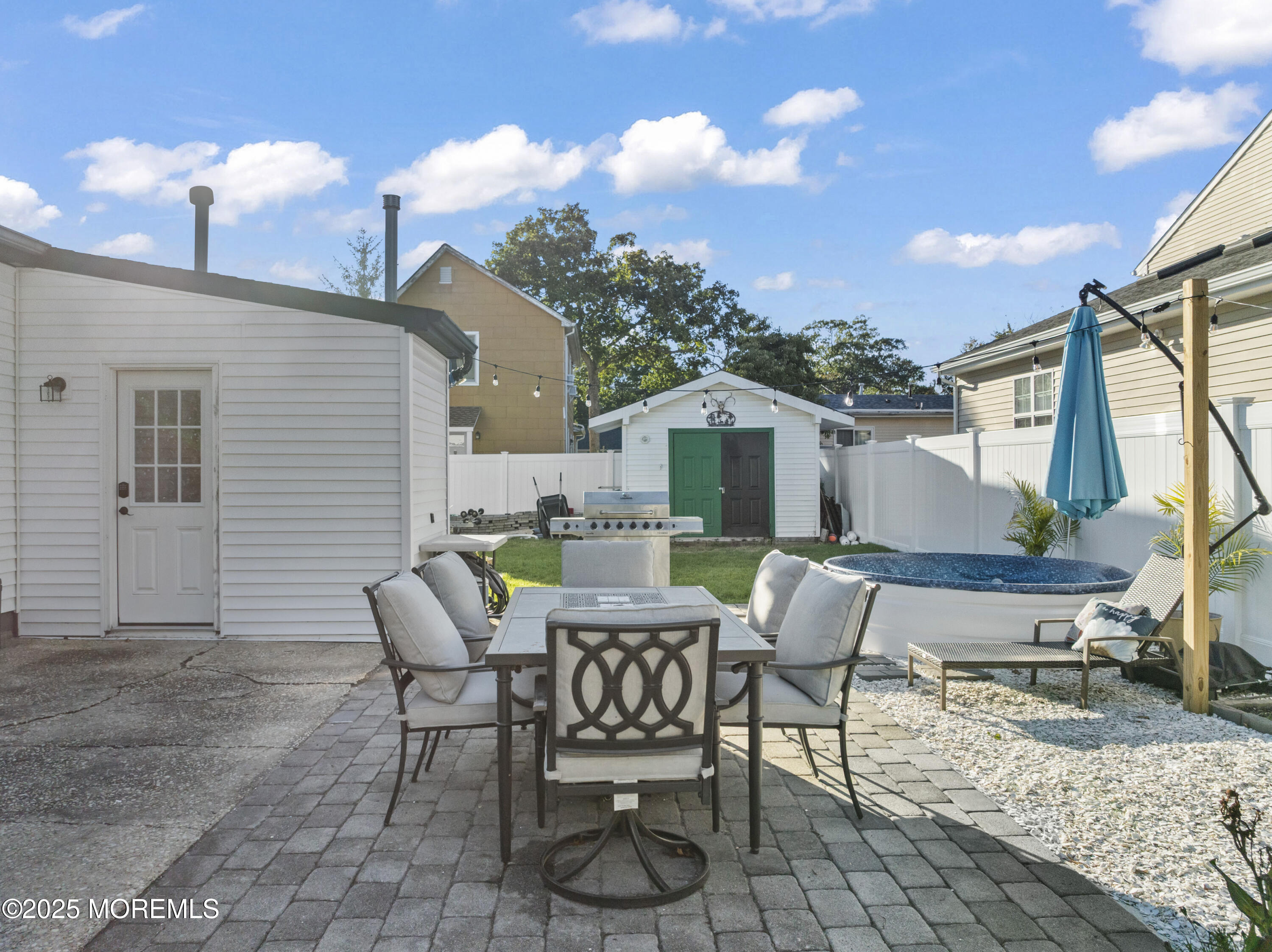 240 Timberline Road Toms River, NJ 08753 - Photo 7 of 25 a patio with table and chairs and potted plants