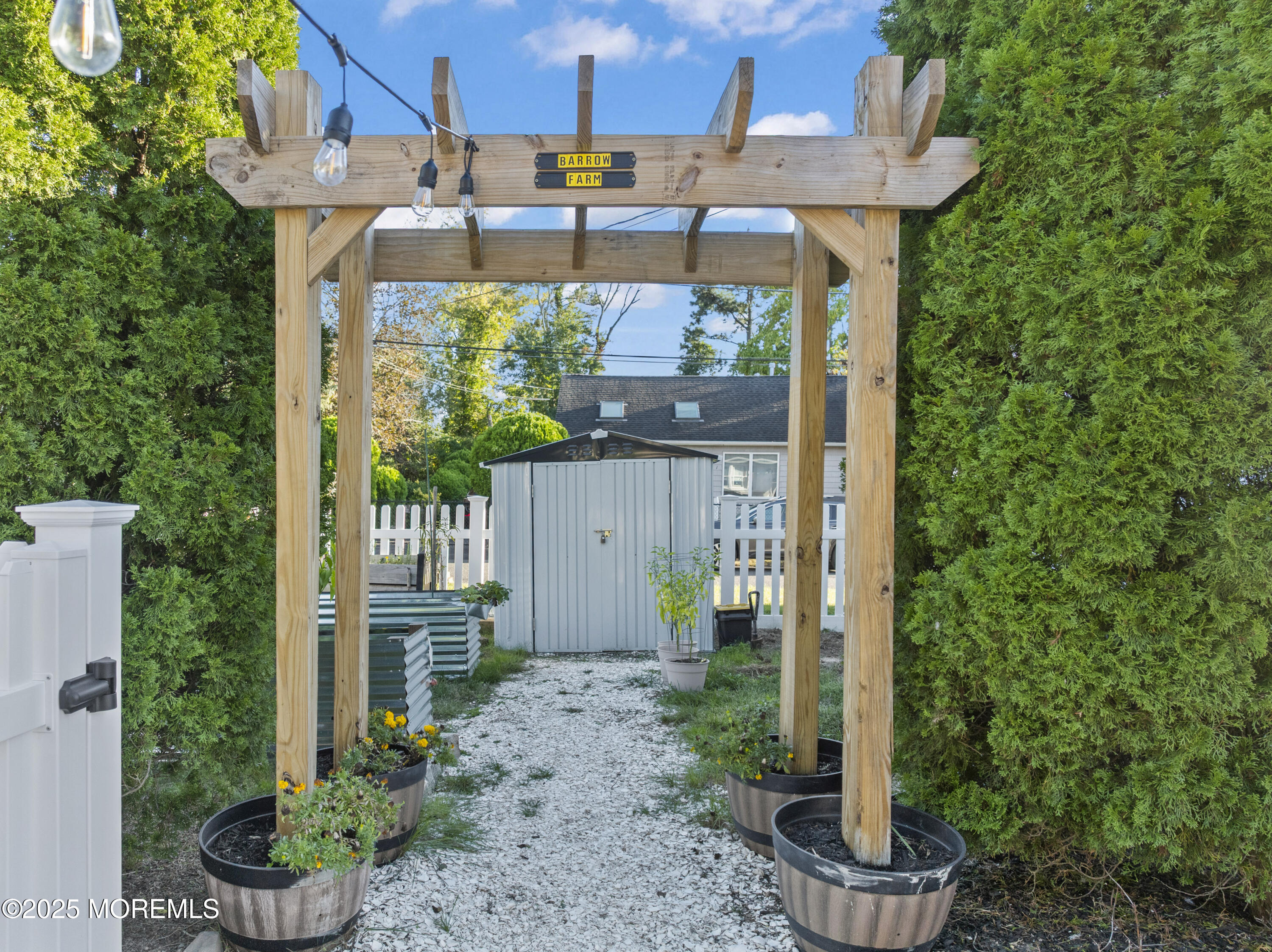 240 Timberline Road Toms River, NJ 08753 - Photo 9 of 25 a view of a patio with table and chairs potted plants