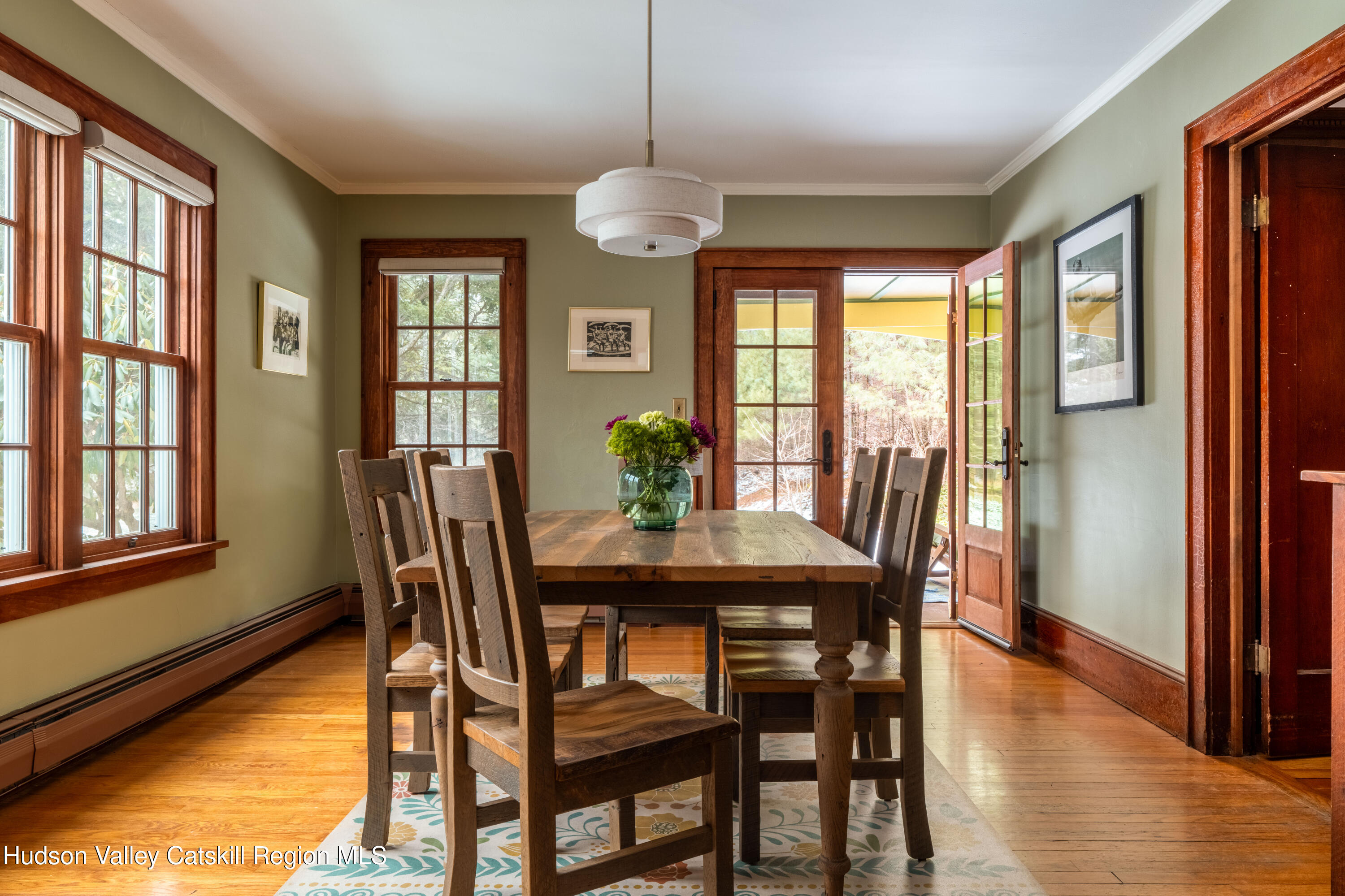 72 High Point Mountain Road West Shokan, NY 12494 - Photo 12 of 33 a dining room with furniture a chandelier and wooden floor