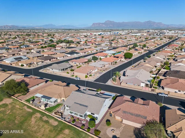 an aerial view of residential building and lake
