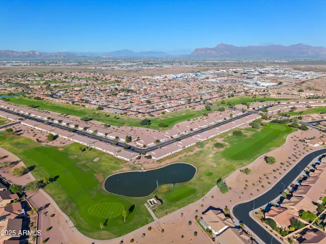 an aerial view of residential houses with outdoor space
