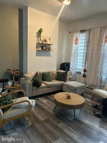 a living room with furniture and a rug