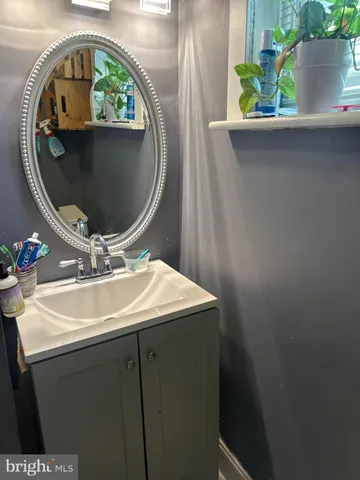 view of a bathroom with a sink and mirror