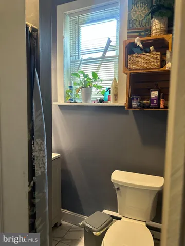 a bathroom with a toilet and a sink