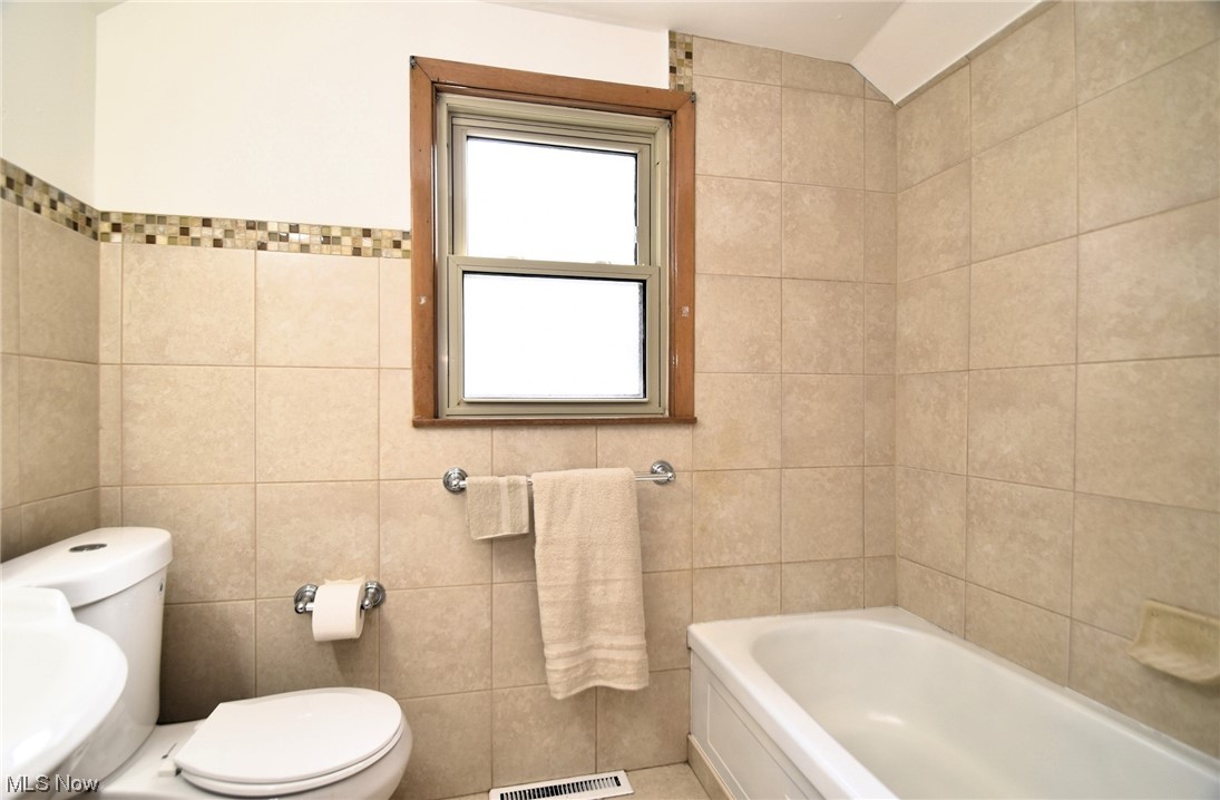 3681 Brinkmore Road Cleveland Heights, OH 44121 - Photo 22 of 27 Bathroom with toilet, tile walls, and sink