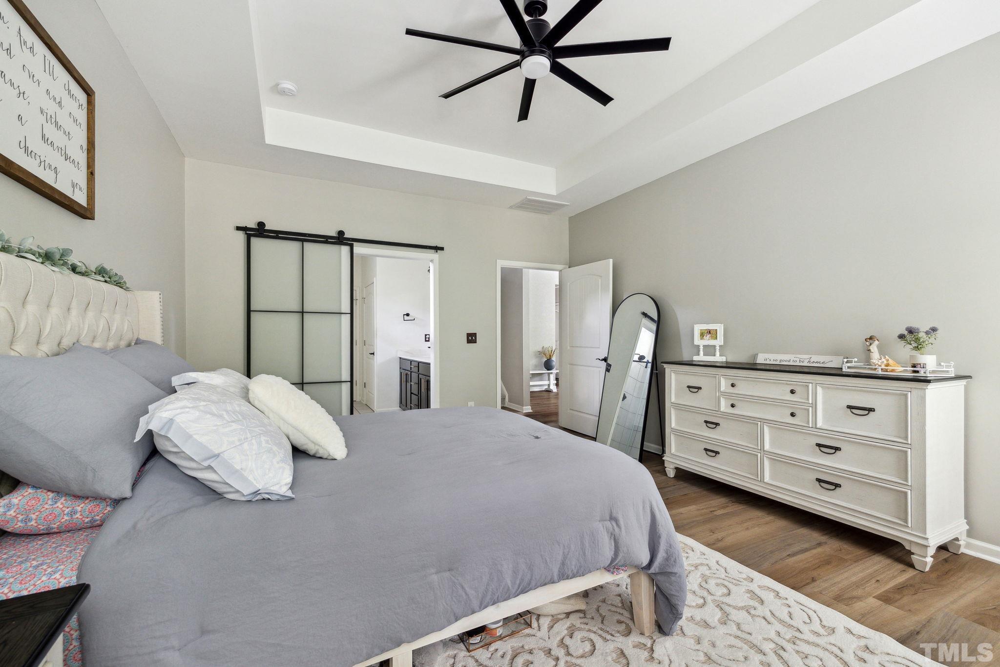 505 Miners Loop Sanford, NC 27330 - Photo 26 of 45 a bedroom with a bed and a dresser