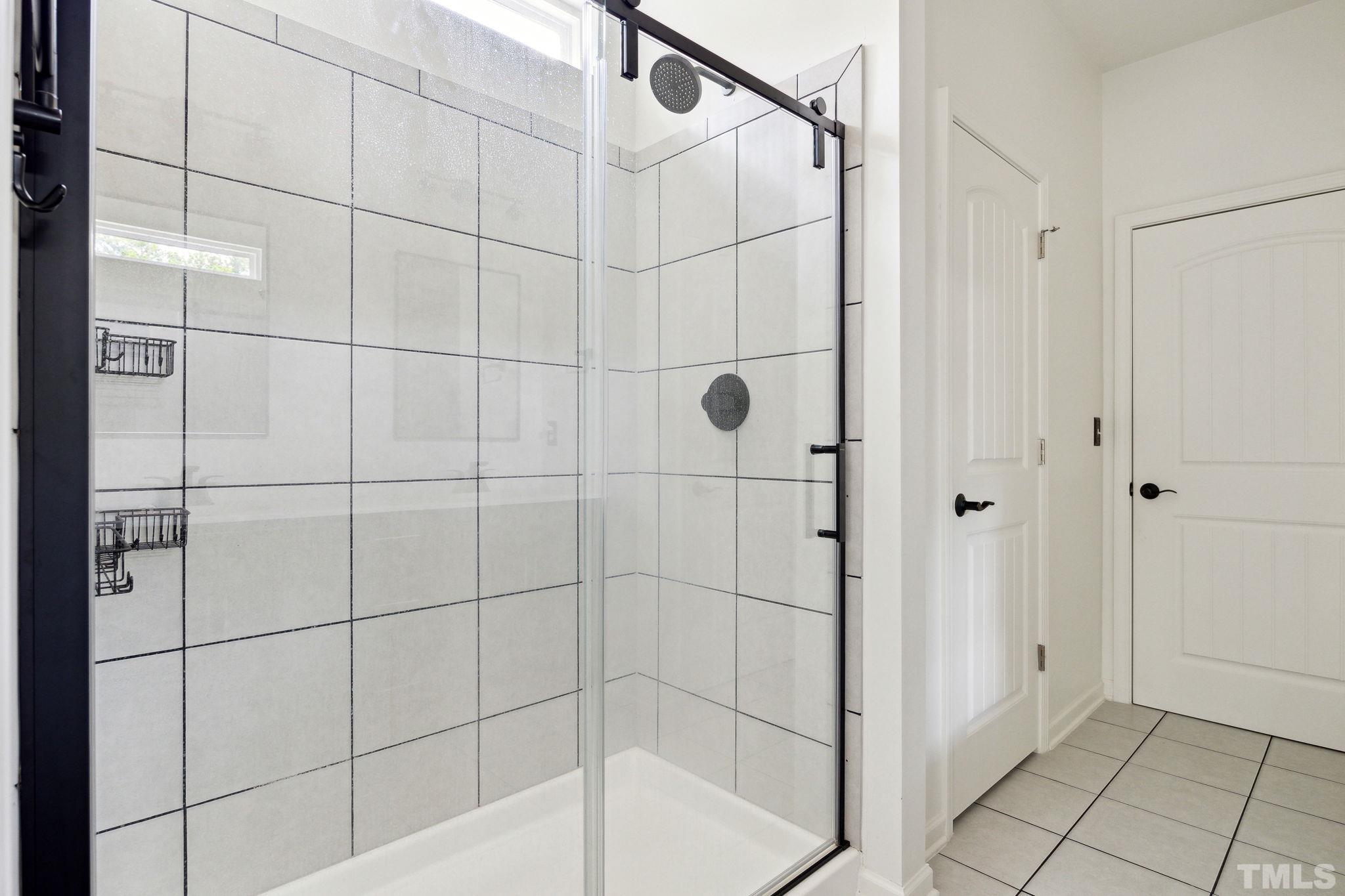 505 Miners Loop Sanford, NC 27330 - Photo 28 of 45 a bathroom with a shower