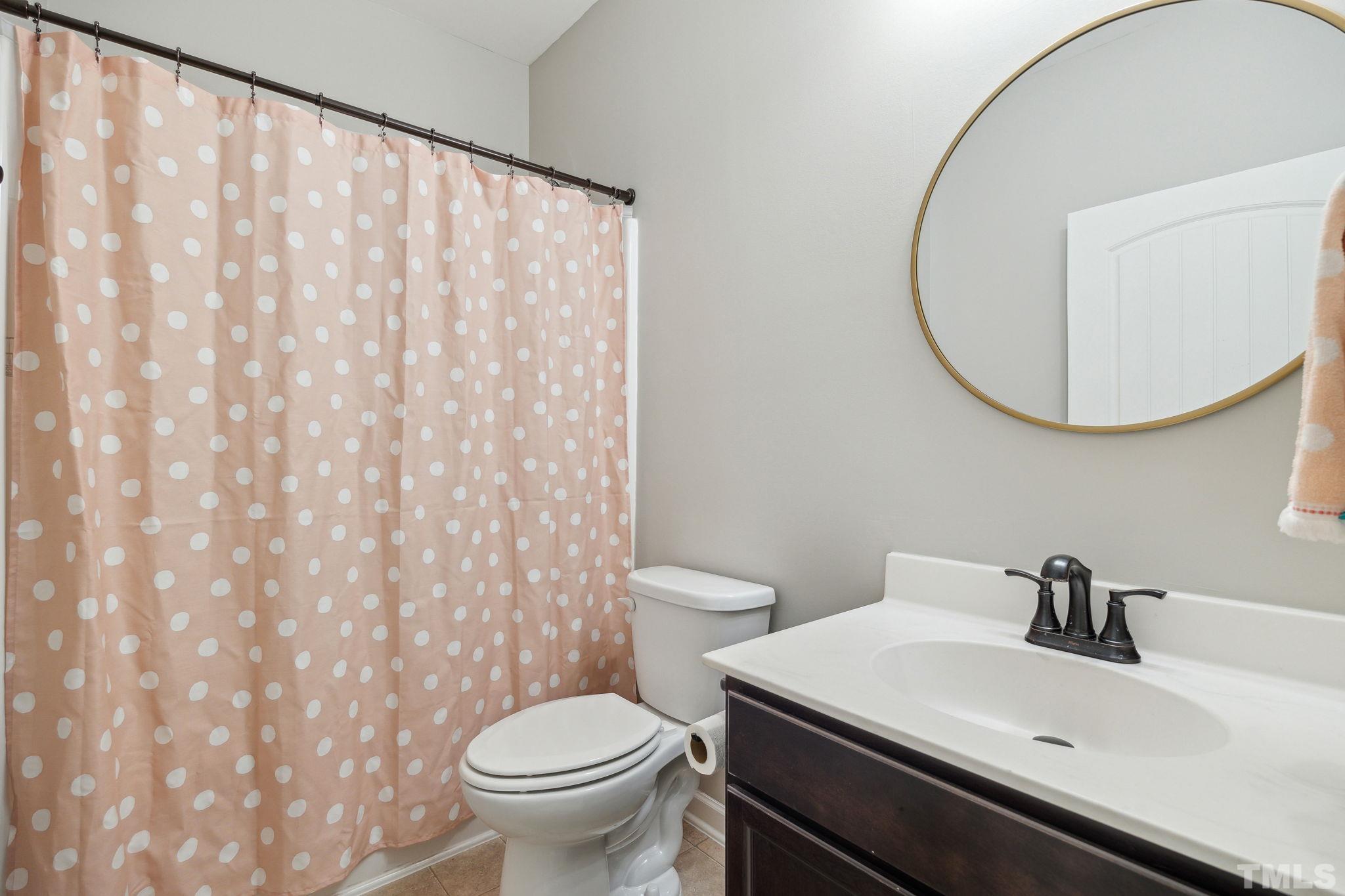 505 Miners Loop Sanford, NC 27330 - Photo 8 of 45 a bathroom with a sink and a toilet