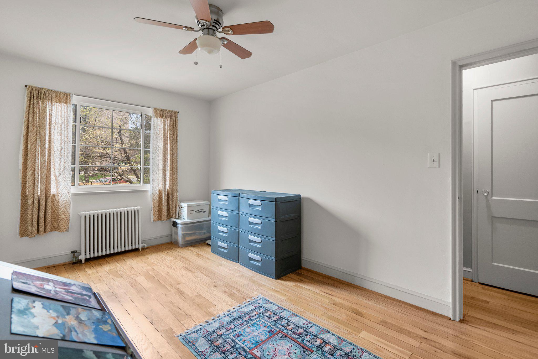 8720 Manchester Road, Unit 4 Silver Spring, MD 20901 - Photo 15 of 28 a room with a dresser and a window