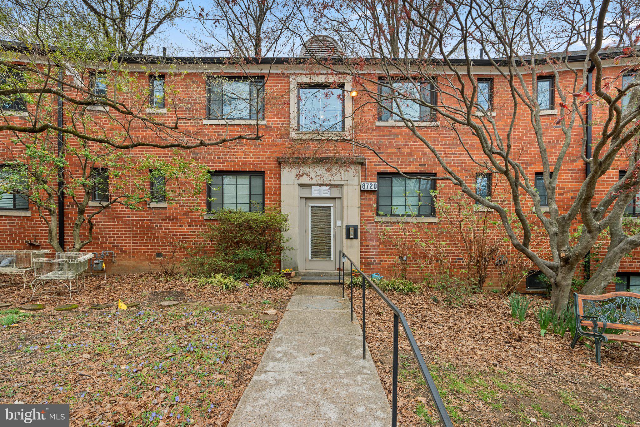 8720 Manchester Road, Unit 4 Silver Spring, MD 20901 - Photo 2 of 28 front view of a house with a yard