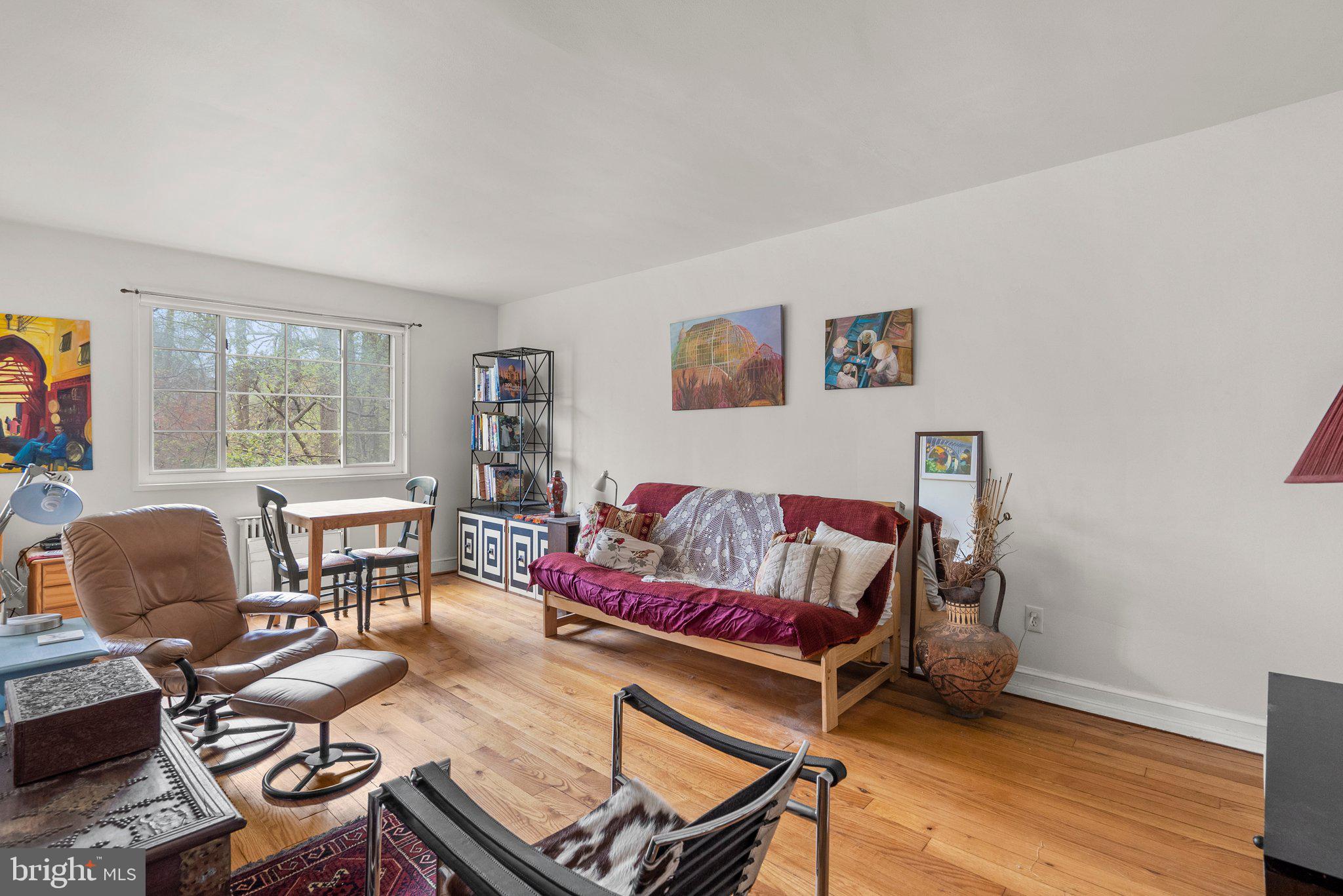 8720 Manchester Road, Unit 4 Silver Spring, MD 20901 - Photo 5 of 28 a living room with furniture and a window