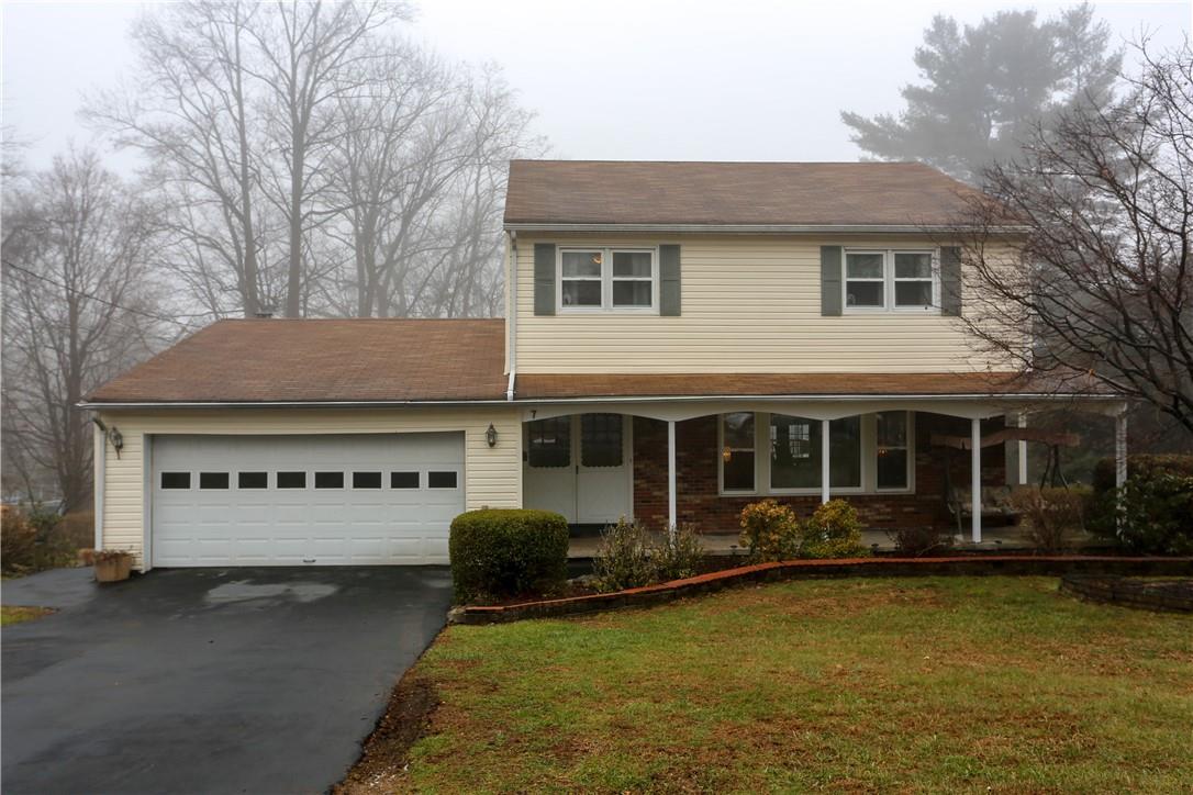 a view of a house with a garden and swimming pool