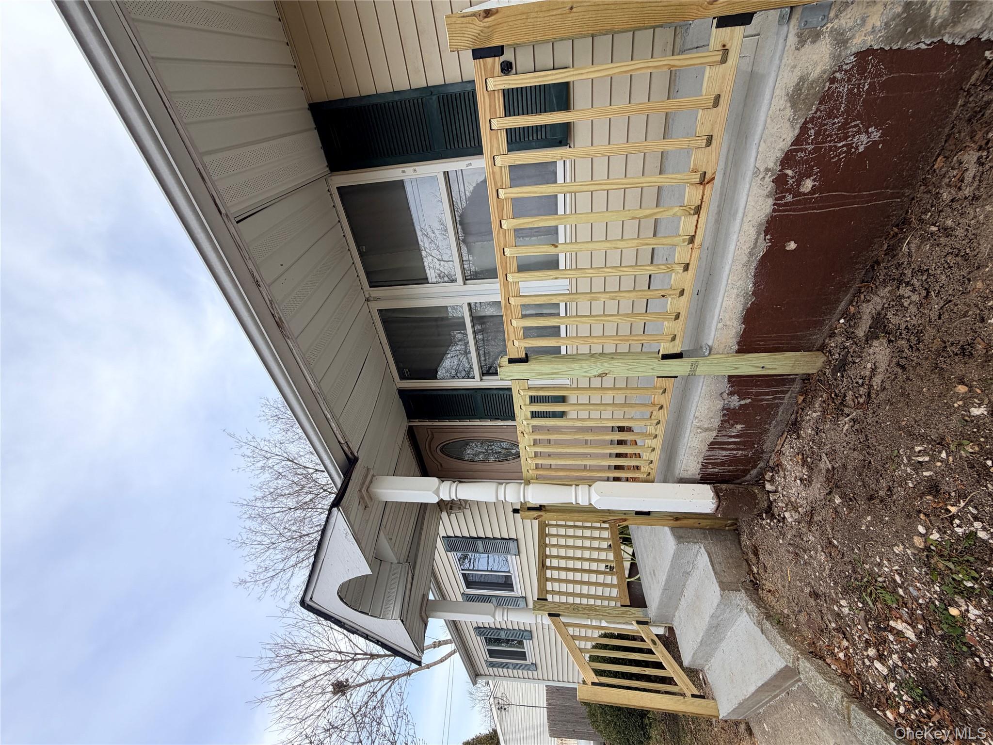 717 Doane Avenue Bellport, NY 11713 - Photo 2 of 12 a front view of a house with a yard