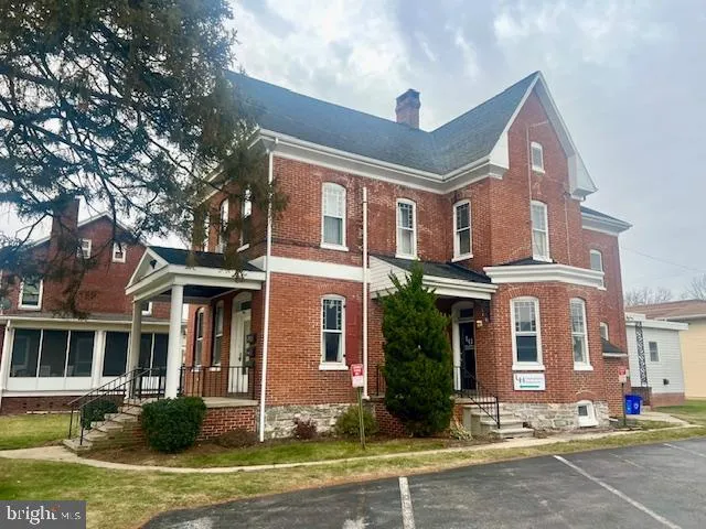 a front view of residential houses with yard