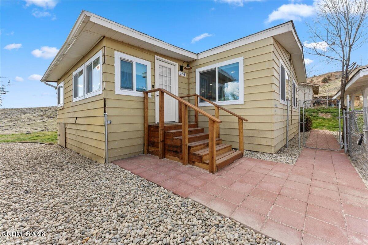 384 Loster Way Sun Valley, NV 89433 - Photo 1 of 35 a view of a house with a yard