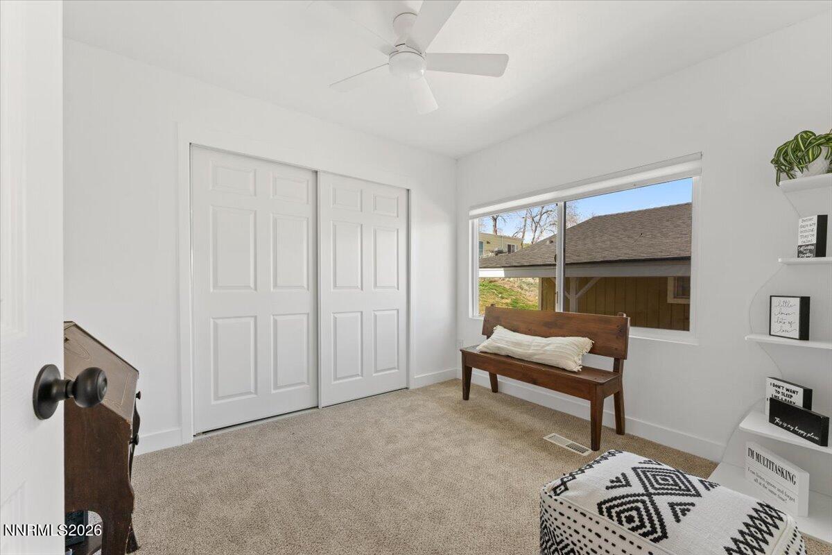 384 Loster Way Sun Valley, NV 89433 - Photo 16 of 35 a bedroom with furniture and a window
