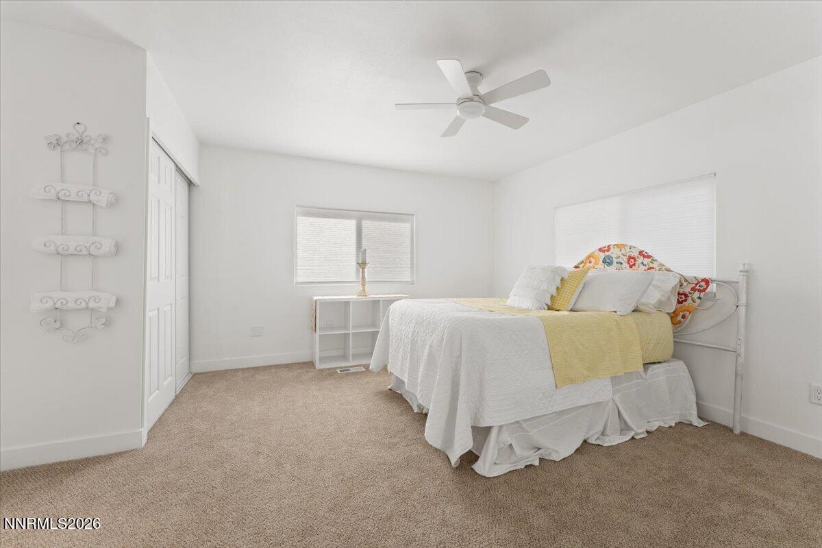 384 Loster Way Sun Valley, NV 89433 - Photo 17 of 35 a bedroom with a bed and a window