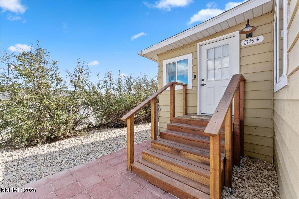 384 Loster Way Sun Valley, NV 89433 - Photo 2 of 35 a view of a house with staircase and wooden stairs