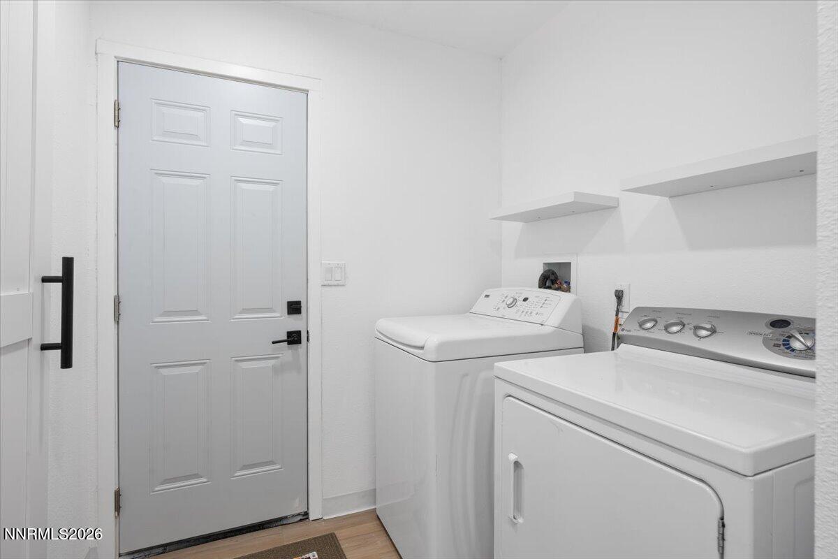 384 Loster Way Sun Valley, NV 89433 - Photo 26 of 35 a utility room with dryer and washer