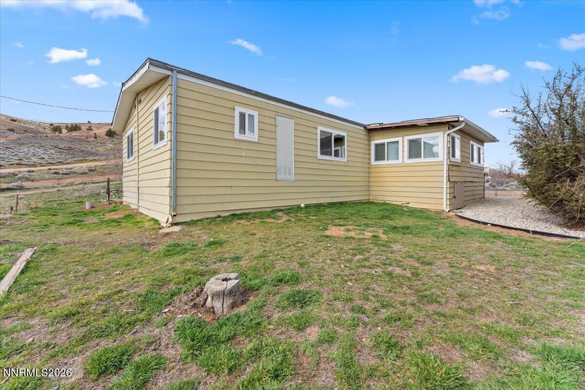 384 Loster Way Sun Valley, NV 89433 - Photo 27 of 35 a house view with a backyard space