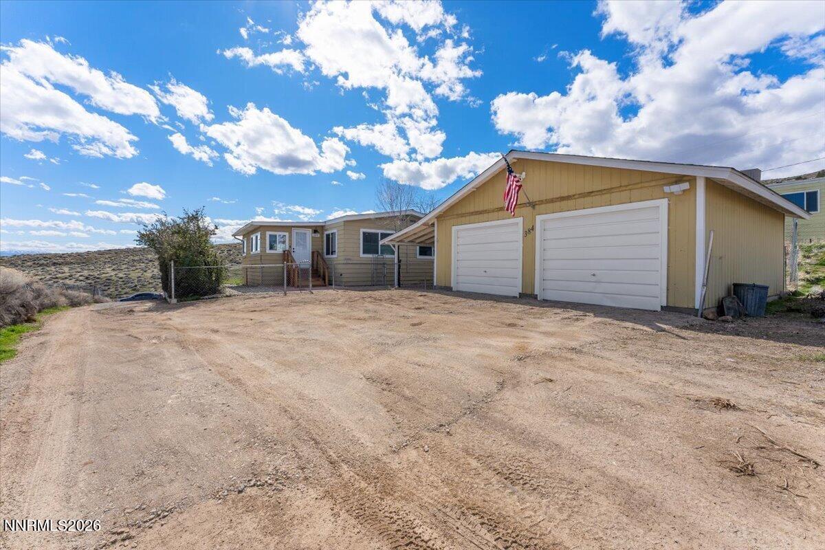 384 Loster Way Sun Valley, NV 89433 - Photo 3 of 35 a view of a house with a yard
