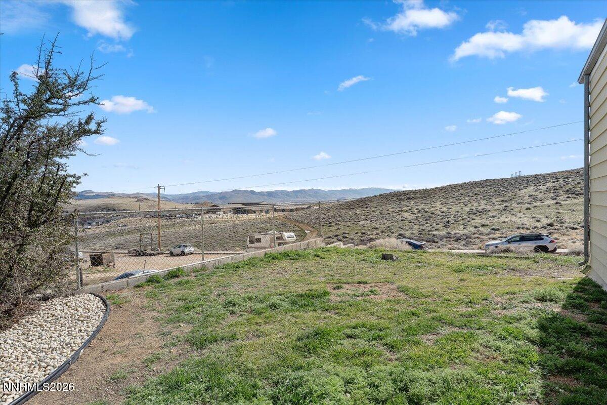 384 Loster Way Sun Valley, NV 89433 - Photo 31 of 35 a view of a lake with beach