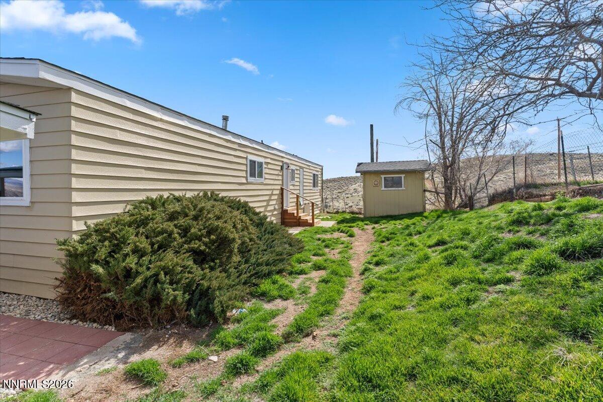 384 Loster Way Sun Valley, NV 89433 - Photo 33 of 35 a view of a house with a yard