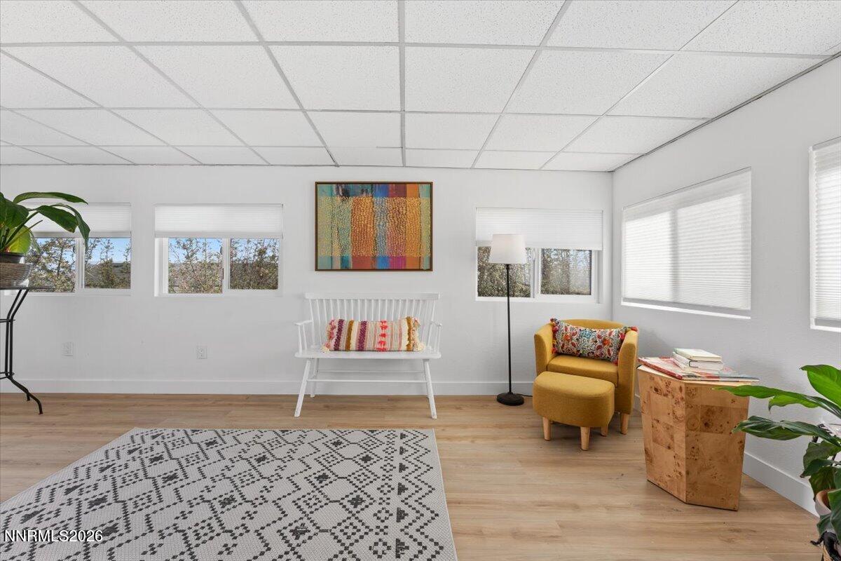 384 Loster Way Sun Valley, NV 89433 - Photo 5 of 35 a bedroom with furniture and a wooden floor