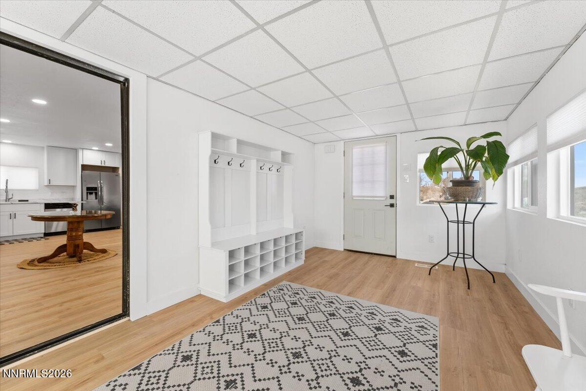 384 Loster Way Sun Valley, NV 89433 - Photo 6 of 35 a view of entryway with wooden floor