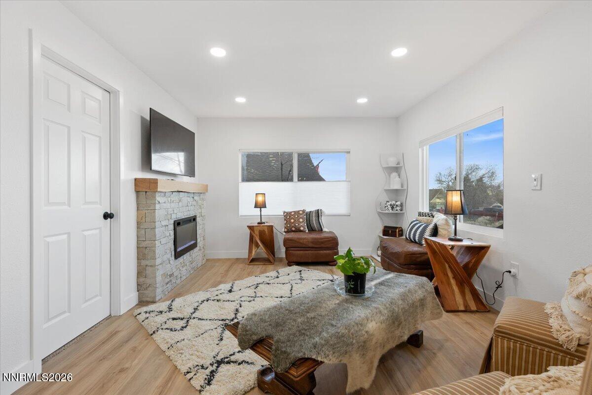 384 Loster Way Sun Valley, NV 89433 - Photo 8 of 35 a living room with furniture and a fireplace