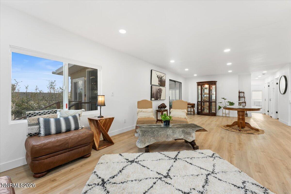 384 Loster Way Sun Valley, NV 89433 - Photo 9 of 35 a living room with furniture and a table