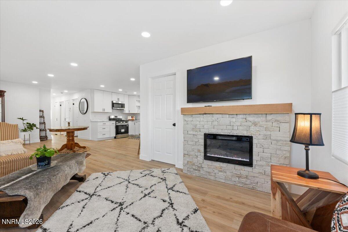 384 Loster Way Sun Valley, NV 89433 - Photo 10 of 35 a living room with furniture and a fireplace