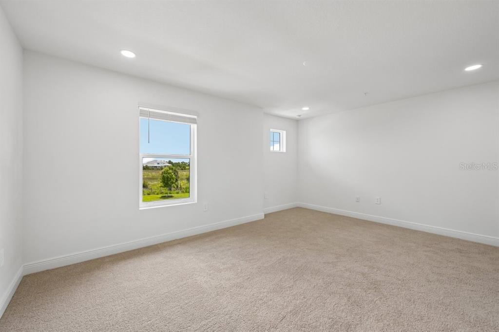 17712 Broadleaf Loop Venice, FL 34293 - Photo 8 of 23 an empty room with a window
