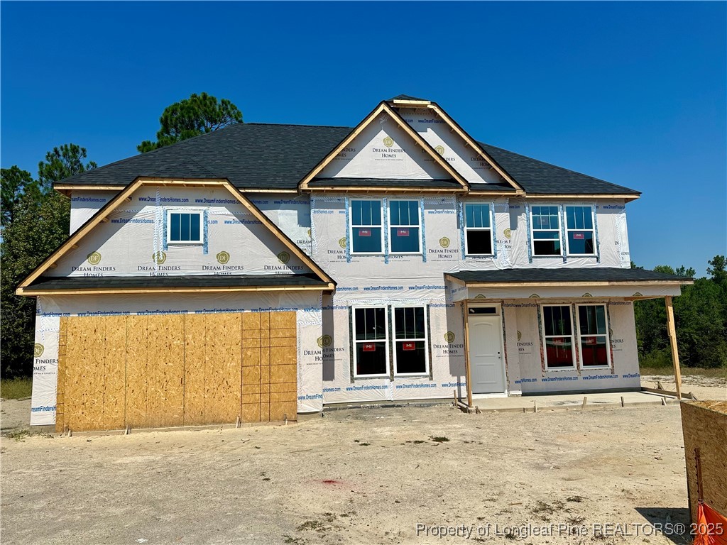 42 Willow Walk Way Cameron, NC 28326 - Photo 3 of 5 a front view of a house with a yard