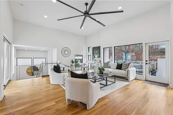 a view of a dining room with furniture and wooden floor