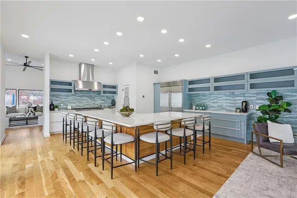 a view of a dining room kitchen with furniture and wooden floor