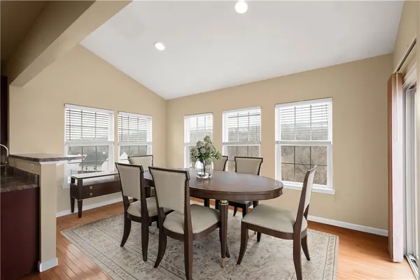 a view of a dining room with furniture window and outside view