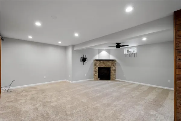 an empty room with a fireplace