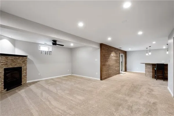 a view of an empty room with a fireplace