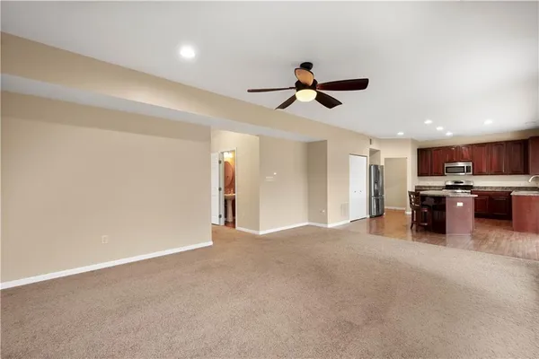 a view of a kitchen with a sink and a window