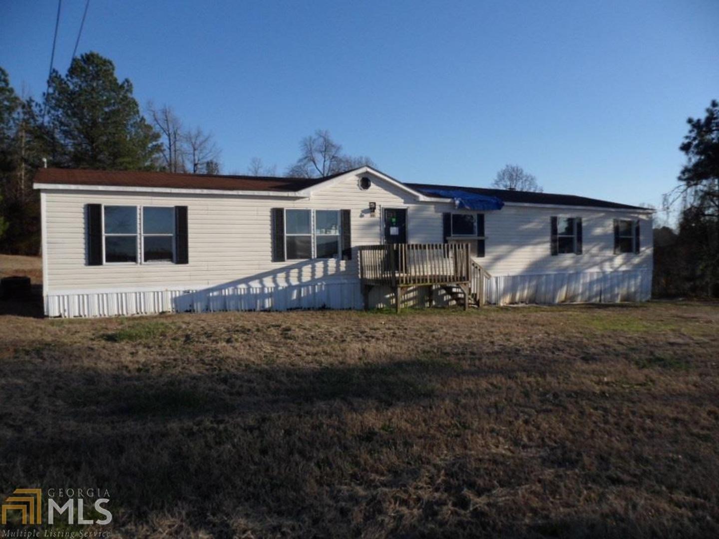 311 Jordan Road Toccoa, GA 30577 - Photo 1 of 1 a front view of a house with garden