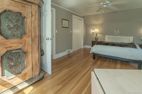 a bedroom with a bed and a fireplace