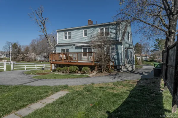 a view of a house with a yard porch and sitting area