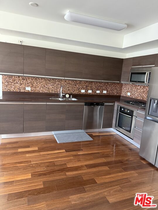 3785 Wilshire Boulevard, Unit 1504 Los Angeles, CA 90010 - Photo 4 of 9 a view of a living room and kitchen