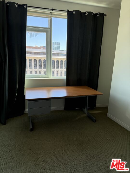 3785 Wilshire Boulevard, Unit 1504 Los Angeles, CA 90010 - Photo 8 of 9 a room with furniture and window