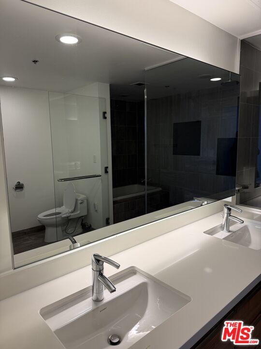 3785 Wilshire Boulevard, Unit 1504 Los Angeles, CA 90010 - Photo 9 of 9 a bathroom with a sink and a mirror