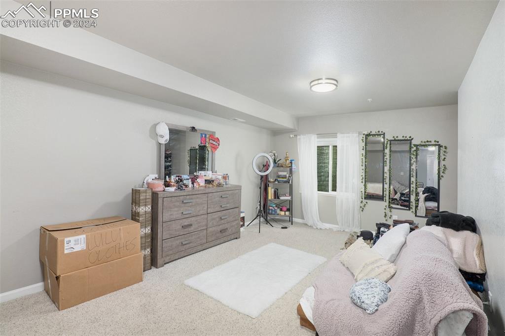 4346 Yellow Dock Point Colorado Springs, CO 80911 - Photo 18 of 20 a bed room with a bed and a dresser