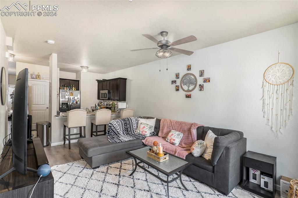 4346 Yellow Dock Point Colorado Springs, CO 80911 - Photo 2 of 20 a living room with furniture and a flat screen tv