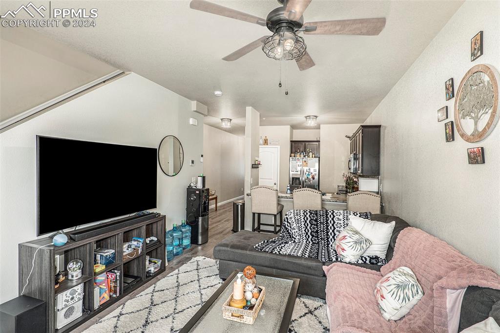 4346 Yellow Dock Point Colorado Springs, CO 80911 - Photo 3 of 20 a living room with furniture and a flat screen tv